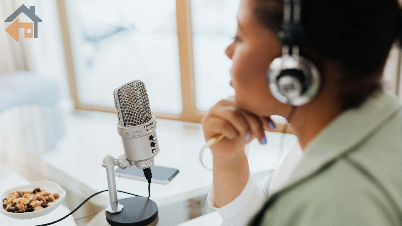 Financial expert wearing headphones speaks into a microphone, representing financial media hosts giving reverse mortgage advice